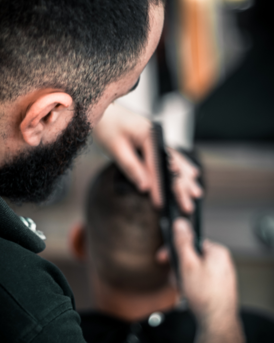 Barber giving a fade